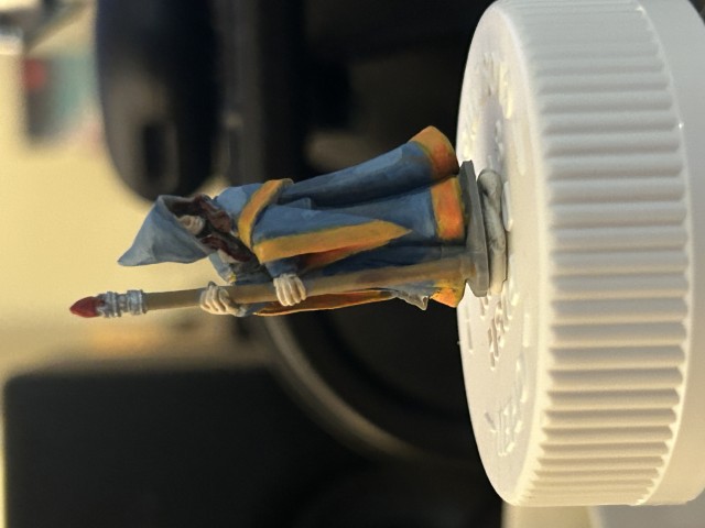 Wizard woman in blue robes with a staff miniture.